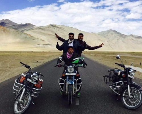 Group of bikers riding through Leh Manali highway on Ladakh bike tour"
